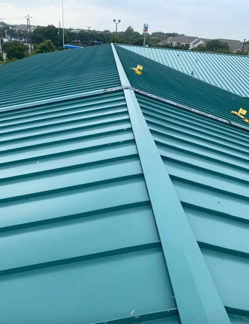 Green commercial metal roof ridge and valley for Metal Roof Repair in Bellefonte